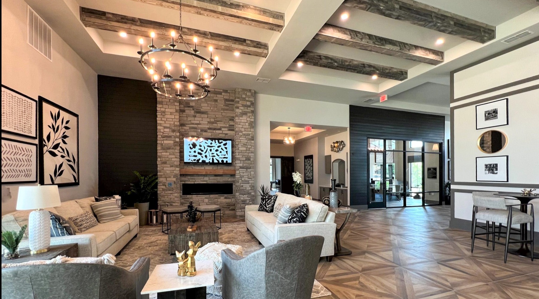 a spacious lounge with a media area and a fireplace