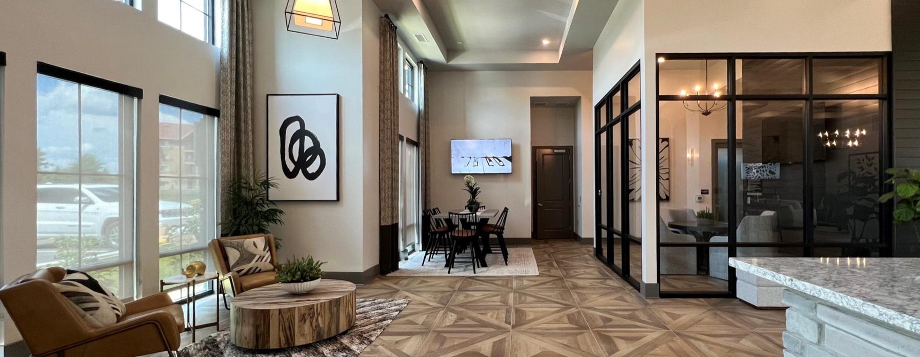 a room with a large glass door and a large rug