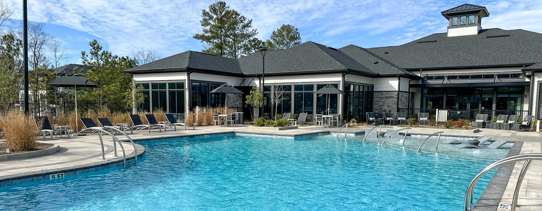 a swimming pool in front of a building