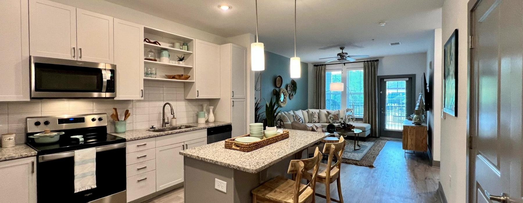 a kitchen with white cabinets
