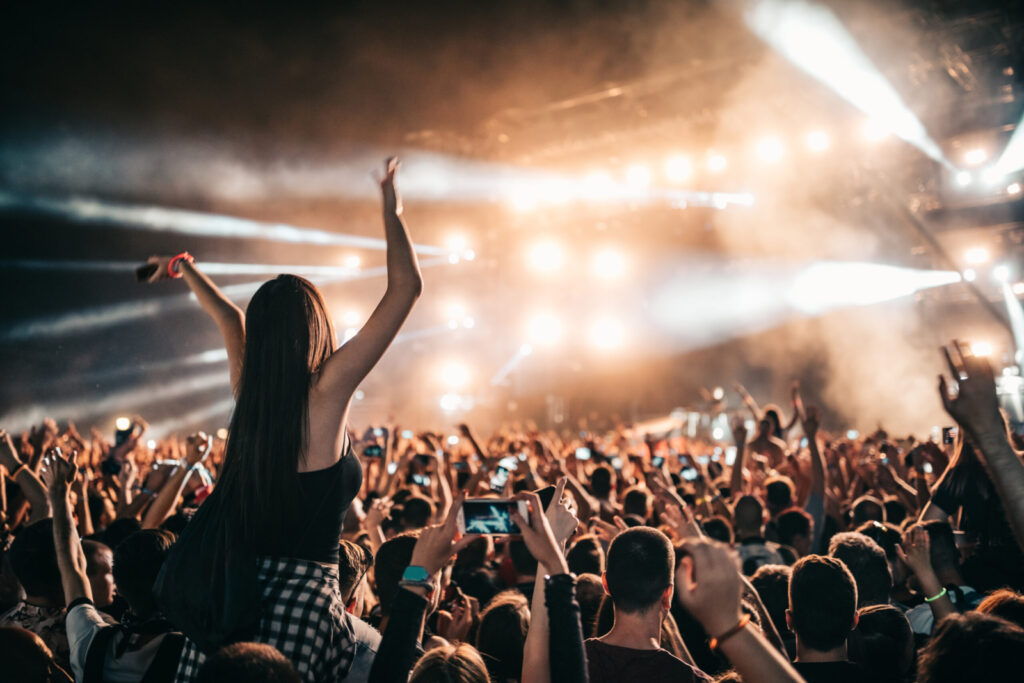 Music festival with girl waving hands