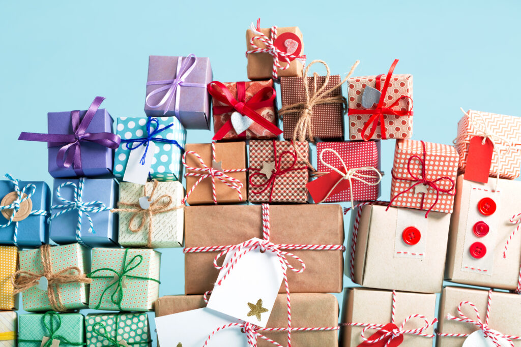 Collection of Christmas present boxes on a light blue background