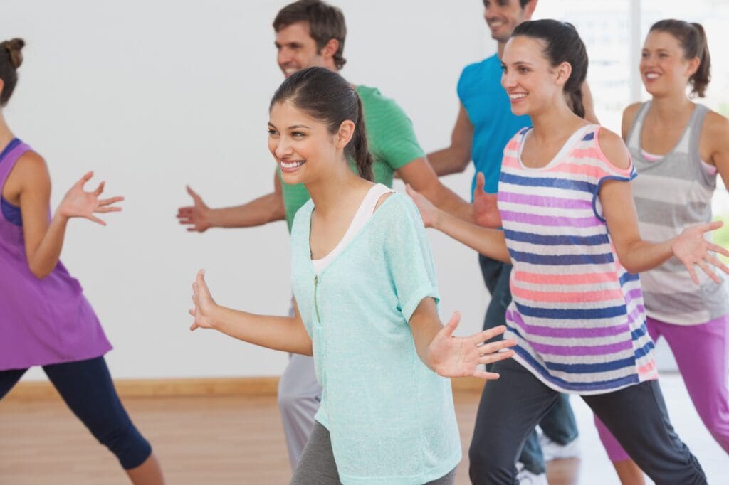 group of people dancing and smiling 